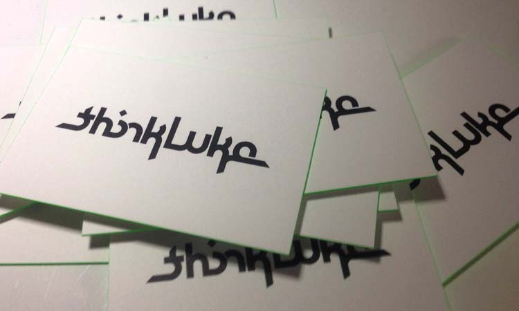 thinkLuke business cards with green edging